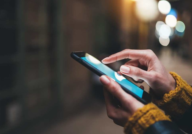 close up image of hands using a smartphone