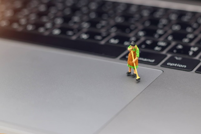 woman sweeping laptop