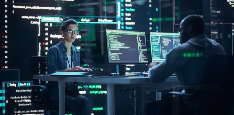 Man and Women looking at computers