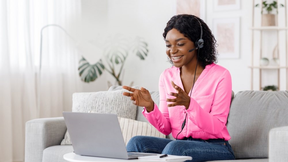 woman with headset ad laptop working from home